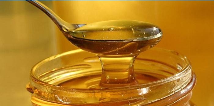 Een eetlepel honing en een pot