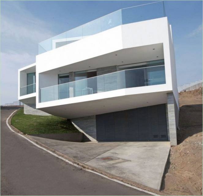 Driedimensionaal huis met uitzicht op zee
